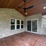 673 Black Earth Rear Covered Porch Stamped Colored Concrete Cedar Wood Ceiling