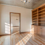 1354 Lucy Ln Office. Tin Ceiling. Stained Maple Custom Built-In Bookshelves. Site Finished Maple Hardwood Floors.