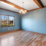 1354 Lucy Ln Owners Bedroom + Ceiling Beams. Site Finished Maple Hardwood Floors. Crown Molding.