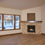 514 Rosemary Great Room + Stacked Stone Fireplace to Mantel Height. Luxury Vinyl Plank Floors.