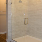 7714 Saint Andrews Owners Tiled Shower. Tiled Walls with Fiberglass Base and Heavy Glass Enclosure.