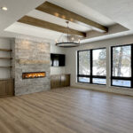 N3101 Right of Way Road Great Room + Fireplace N3101 Right of Way Road Great Room. Stacked Stone Linear Modern Fireplace. Built-in Cabinets with Floating Shelves. Black windows with plastered drywall returns. Tray ceiling with stained maple wood beams. Luxury vinyl plank floors. 4-panel interior doors.