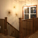 1726 Symphony Heights Foyer + Stairs. Stained Maple Square Wood Balusters