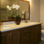 1726 Symphony Heights Owner's Bathroom Vanity. Quartz Countertops. Wood Framed Mirror. Stained Maple Vanity Cabinet.