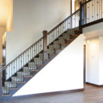 5012 Potters Crossing Foyer + Stairs. Open Stair Railing with LJ Smith 4091 Stained Maple Newel Posts and Iron Balusters.