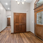 3597 E Hank Foyer. Arch-Top Transom. Stained Fiberglass Entry Door.