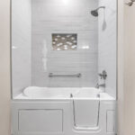 3597 E Hank Main Bathroom Walk-In Tub. Tiled Walls with Shampoo Niche. ADA Accessibility.