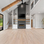 704 Royal St Pats Living Room Fireplace Ceiling Beams 704 Royal St Pats Living Room. Black Painted Shiplap (Sherwin-Williams Iron Ore SW-7069) Fireplace Surround with Mitered Corners and Reclaimed Hewn Timber Mantel. Stained Maple Floating Shelves. TV Above Fireplace. Luxury Vinyl Plank Flooring. Hewn Timber Ceiling Beams at Vaulted Ceiling. Black Windows with White Painted Trim.