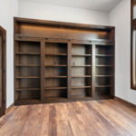 10510 Sugar Creek Office. Built-In Maple Bookcases with Hidden Murphy Door.