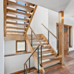 10510 Sugar Creek Open Riser Stairs. Maple Glu-Lam, Black Cable Rail.