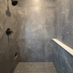 10510 Sugar Creek Tiled Shower. Walk-In Tiled Shower with Herringbone Pattern, Shampoo Ledge Wall, and Foot Niche.