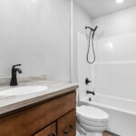 4749 Whitefish Bay Main Bathroom. Stained Maple Vanity.