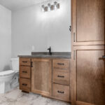 4749 Whitefish Bay Owners Bathroom. Knight Tile River Marble Vinyl Tile Floors. Stained Maple Vanity.