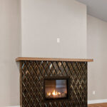 9185 Rasner Living Room & Fireplace. Farrington Crest Cigar Hickory Laminate Plank Flooring. Cabot Black Jade Brass Inlay Fireplace Tiled Surround.