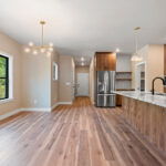 9185 Rasner Kitchen. Vertical Grain Black Walnut Slab Front Modern Cabinets. Alpine White Granite Countertops. Floating Shelves. Aquarelle 0 Vapor Tiled Backsplash. Farrington Crest Cigar Hickory Laminate Plank Flooring.