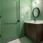 9185 Rasner Powder Room Half Bathroom. Vertical Grain Walnut Slab Front Vanity Cabinet. Penny Round Tile Flooring. Calacatta Sonata Granite Countertops. SW9040 Reseda Green.