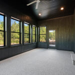 9185 Rasner Three Seasons Room. Black windows. DiamondKote Onyx black vertical grooved wall panels.