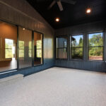 9185 Rasner Three Seasons Room. Black windows. DiamondKote Onyx black vertical grooved wall panels.