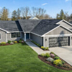 237 Park St Exterior (Landscaping by AI). Black Windows, Black Overhead Garage Doors, White Fascia, Gentek Sequoia Select "Hudson Slate" Siding, Moire Black Shingles.