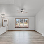 237 Park St Living Room. Half Wall with Wood Cap. Vinyl Plank Floors.