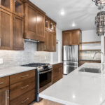 3409 Schubert Kitchen. Mont Blanc Quartzite Countertops. Kentmore Lodge "Natural Canvas Oak" Vinyl Plank Flooring. Wood Hood.