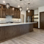 3409 Schubert Kitchen. Mont Blanc Quartzite Countertops. Kentmore Lodge "Natural Canvas Oak" Vinyl Plank Flooring. Wood Hood.
