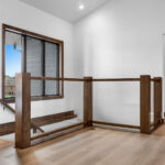 3409 Schubert Stairs. Custom Maple Square Newel Posts. Interior Glass Railing.